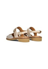 Beige leren sandalen met een textuurpaneel, verstelbare gesp en een stevige tan zool. Open ontwerp met een platte hak.
