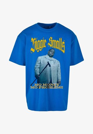 Niebieska bawełniana koszulka z nadrukiem przedstawiającym mężczyznę w szarym garniturze, trzymającego laskę, z tekstem "Biggie Smalls" i "Mo Money Mo Problems" w kolorze żółtym.