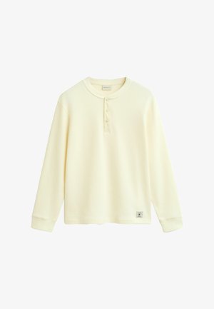 Lange mouwen katoenen shirt in lichtbeige met een gestructureerd wafelpatroon, voorzien van een ronde hals, een vijfknopenlijst en een logotag op de zoom.