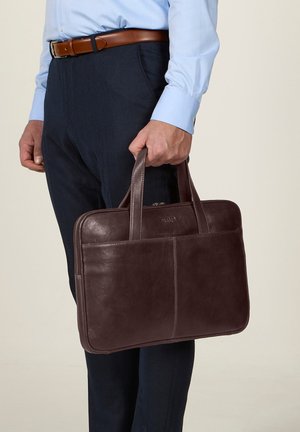 Leather laptop bag in dark brown, featuring two handles, a zip closure, and a front pocket. Smooth texture, rectangular shape, and minimal accents.