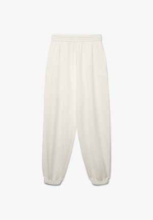 Pantaloni jogger beige chiaro con vita elasticizzata, polsini a coste e tasche laterali, realizzati in un tessuto morbido ed elastico.