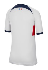 Camisa blanca de manga corta con cuello y mangas en navy. Acento rojo en el lado inferior. Pequeño detalle de la bandera francesa en la parte posterior. Textura suave.