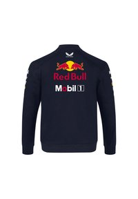 Granatowa kurtka z długimi rękawami, na plecach z logo Red Bull i Mobil 1. Wykonana z miękkiego materiału z prążkowanymi mankietami i dołem.
