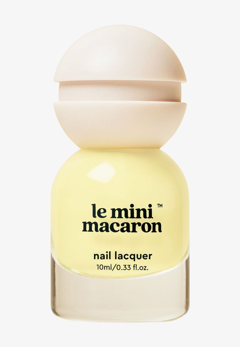 Lacca per unghie gialla in una bottiglia di vetro sferica con un tappo beige. Testo: "le mini macaron lacca per unghie, 10ml/0.33 fl. oz."