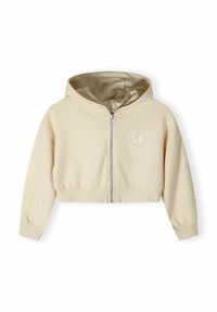 Sudadera beige recortada con cremallera frontal, capucha adjunta, puños y bajo acanalados. Presenta un sutil estampado blanco centrado en el pecho.