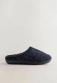 Navy blue slipper made of textured fabric with a rounded toe and open back, featuring a black rubber sole for durability.