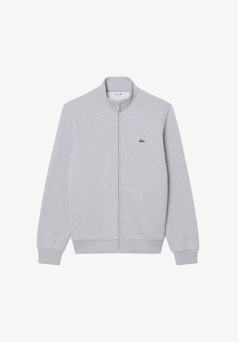 Sweat-shirt gris clair zippé avec poignets et ourlet côtelés, avec un petit logo crocodile vert sur la poitrine gauche.