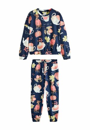 Haut à manches longues bleu marine et pantalon avec des imprimés sur le thème de l'automne incluant des chiens en pulls roses, des théières, des citrouilles, des feuilles et des parts de tarte.