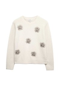 Svetle béžový svetr s kulatým výstřihem a dlouhými rukávy, zdobený stříbrnými hvězdicovými aplikacemi. Měkká textura.