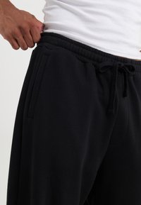 YOURTURN UNISEX - Dresside alumine osa - black