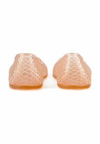 Translucent peach ballet flats with a textured diamond pattern, rounded toes, and a flexible rubber sole.