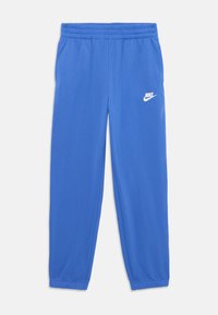Plave Nike trenirke s elastičnom trakom u struku i na rubovima, na gornjoj lijevoj bedrima s bijelim Nike logotipom.