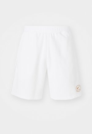 Pantaloni sportivi bianchi con un elastico in vita, realizzati in un tessuto morbido, con un piccolo logo arancione Nike Air in basso a destra.