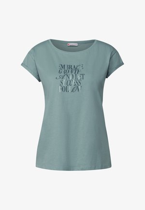 T-shirt en coton vert menthe à manches courtes et col rond. Présente un motif de texte imprimé en typographies variées sur le devant.
