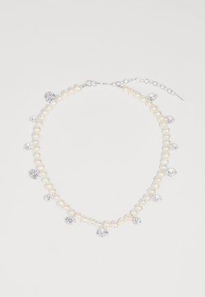 Pearl necklace with silver-tone hardware, featuring evenly spaced crystal accents among lustrous white pearls. Adjustable chain for length.
