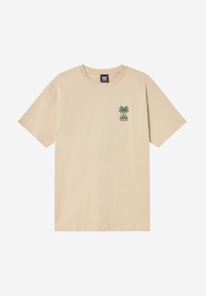 T-shirt beige a maniche corte con piccolo motivo di palma e sole sul lato sinistro del petto e scollo rotondo.