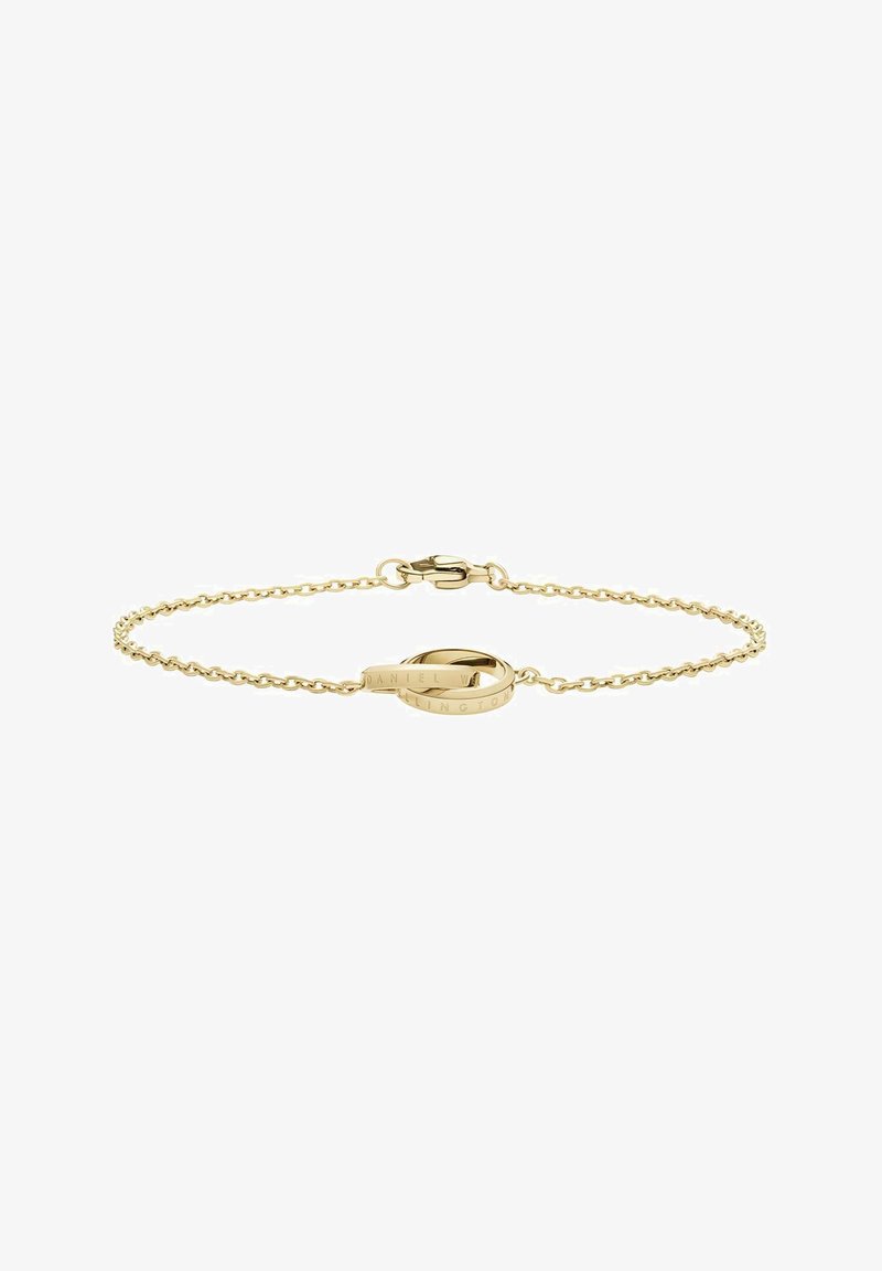 Zlato premazana zapestnica z nežno verigo in okroglim obeskom, na katerem je gravirano "DANIEL WELLINGTON." Prilagodljiv zapiralo s ponjavico.