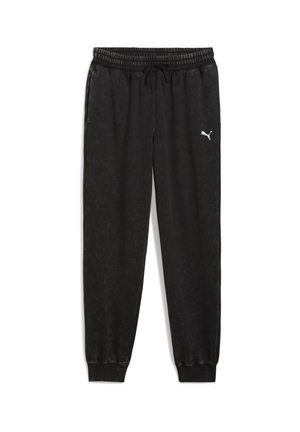 Čierne tepláky vyrobené z jemného materiálu, s elastickým pásom, nápletmi, bočnými vreckami a bielym logom Puma na ľavej nohe.