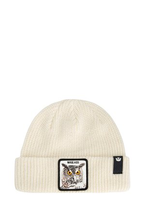 Berretto lavorato a maglia color crema con risvolto, dotato di un patches ricamato che rappresenta un gufo e il testo "WISE ASS". Texture morbida e design caldo.