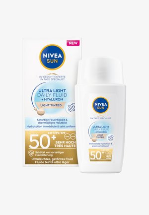NIVEA SUN Ultra Light Daily Fluid, white plastic bottle, light tinted cream, SPF 50+, features a blue circle logo and gold accents on packaging.