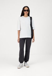 Rip Curl VARSITY PANTS - Trainingsbroek - washed black