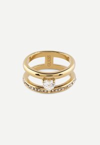 Gold ring with a heart-shaped clear stone, featuring a band adorned with small clear crystals and a polished finish.