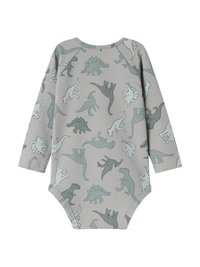 Svijetlo siva pidžama s razigranim uzorkom dinosaura u raznim nijansama zelene, s dugim rukavima i okruglim izrezom.