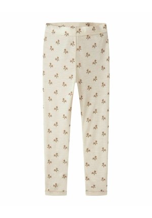 Børneleggings i cremefarve med små brune blomstertryk og elastik i taljen, vist fladt på en hvid baggrund.