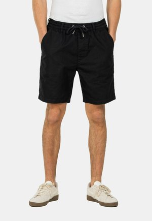 Black shorts made of lightweight fabric, featuring an elastic waistband with drawstring, side pockets, and a relaxed fit.