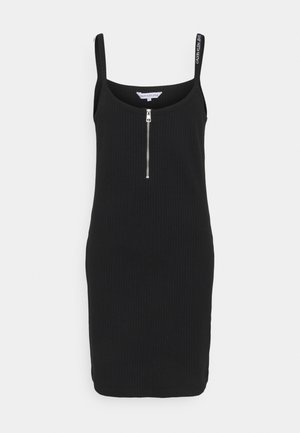 Černé žebrované šaty s tenkými ramínky a předním zipem. Obsahují logo Calvin Klein na ramínku a mají přiléhavý střih.