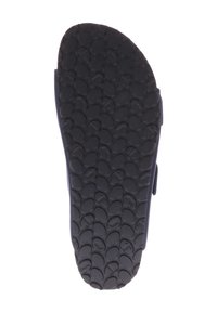 Semelle en caoutchouc noir avec un motif texturé de formes arrondies ; conçue pour une adhérence et une durabilité accrues, avec un bord légèrement surélevé.