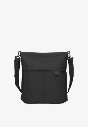 Black crossbody bag with adjustable strap, fold-over top, and small sewn-in brand tag on front center right.