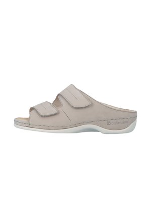Lichtbeige open-toe slidesandal met twee verstelbare klittenbandsluitingen en een gevormde zool voor comfort.