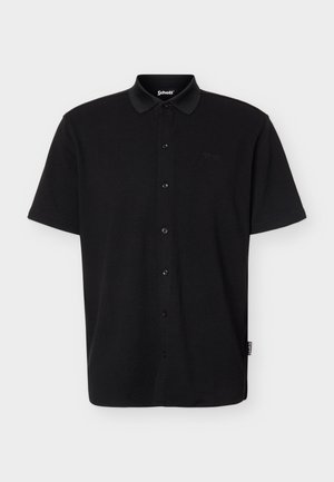 Schwarzes, kurzärmeliges Poloshirt zum Knöpfen mit Kragen, strukturierter Stoff und dezentem Schott-Logo auf der Brust und am Seitenschild.
