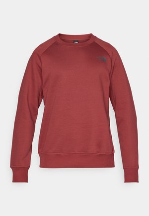 Rode sweatshirt met een ronde hals, lange raglanmouwen, geribde manchetten en een geribde onderkant, met een zwart logo aan de linkerkant. Zacht, gestructureerd materiaal.