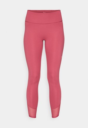 Puma leggings in a mid-pink color, made of a smooth, stretchy fabric with a high waistband and mesh accents near the ankles.
