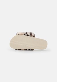 Faux fur slide sandal with a leopard pattern, beige textured sole, and a soft plush upper. The sole features wave patterns for grip.