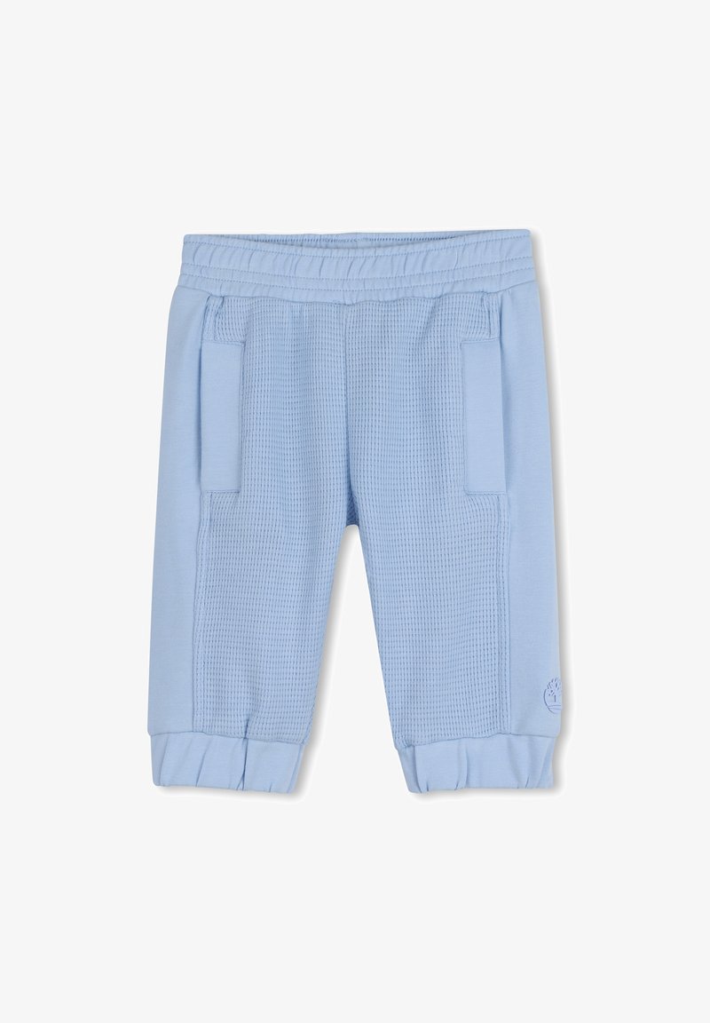 Shorts bleu clair en tricot gaufré texturé, dotés d'une taille élastique et de deux poches latérales. Les bords sont froncés pour un ajustement près du corps.