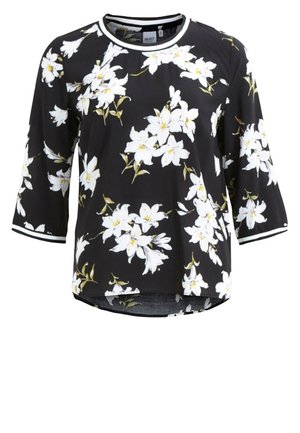 Chemise noire à manches longues avec imprimé floral blanc, col rond et poignets rayés blancs.