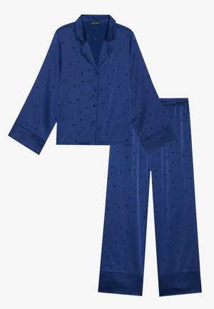 Ensemble de pyjama en satin marine avec un haut à manches longues et un pantalon à taille élastique, présentant un motif d'étoiles et de croissants de lune.