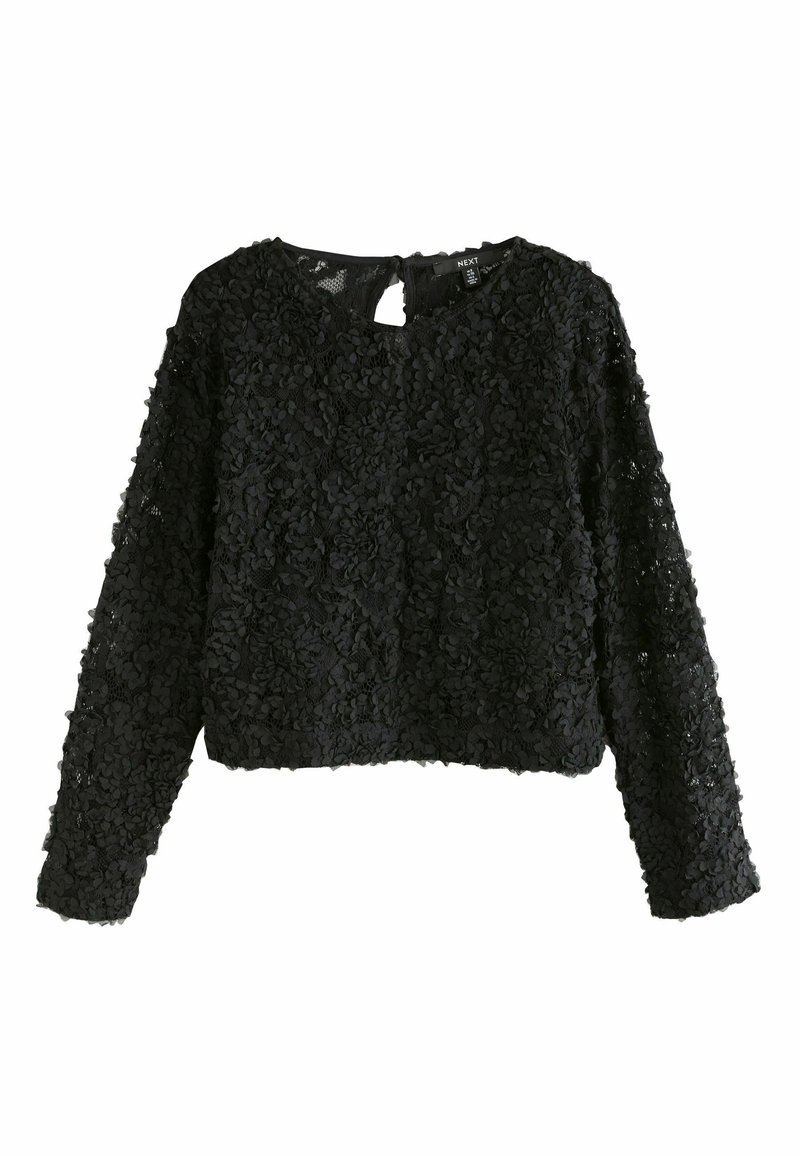 Zwarte langslavige top gemaakt van gestructureerde stof, met een bloemenpatroon. Ronde halslijn met een sleutelgatopening aan de achterkant.