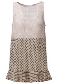 Ärmlös topp med en ljusrosa mönstrad överdel och en beige nederdel med ett mörkblått geometriskt mönster och volang nederkant.