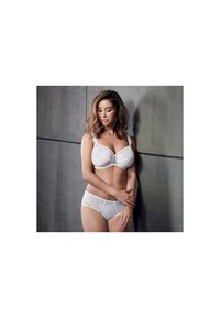 White lace bra and matching panties, featuring floral patterns and semi-sheer fabric. Soft texture and smooth design with adjustable straps.