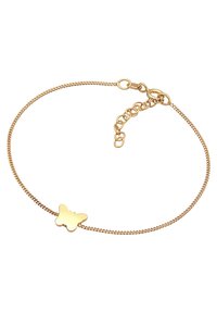 Bracciale in metallo dorato con una sottile catena e un ciondolo a forma di farfalla. Lunghezza regolabile con una piccola chiusura e dettagli in catena.