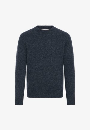 Tamsiai mėlynas megztinis su apvaliu kaklu, ilgomis rankovėmis ir tekstūruotu audiniu. Su gijų apdaila hem ir rankogaliais.