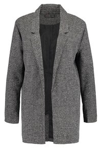 Blazer gris texturé à ouverture frontale, manches longues et doublure intérieure noire, présenté sur fond blanc.