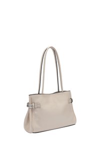 Beżowa skórzana torba tote z dwoma długimi uchwytami, gładką fakturą, bocznymi klamrami i kontrastującym czarnym wnętrzem wzdłuż górnej krawędzi.