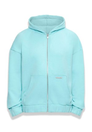 Vaaleansininen vetoketjullinen huppari, joka on valmistettu pehmeästä kankaasta. Siinä on iso huppu, etutaskut ja resorit hihansuissa. Taskussa on huomaamaton logo.