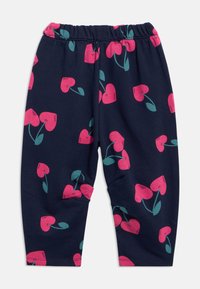 Μπλε σκούρο κολάν με μοτίβο από ροζ καρδιά και πράσινα φύλλα. Απαλό, ελαστικό υλικό με ελαστική μέση για άνεση.