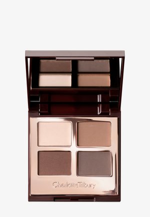 Compact eyeshadow palette with four matte shades in beige, taupe, brown, and dark brown, with a built-in mirror.